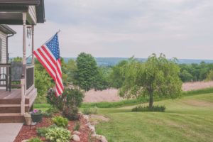 Flag Waving on a Porch
