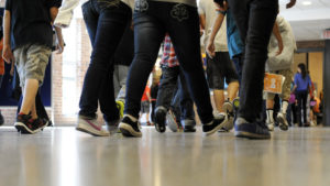 Student Feet Walking in Hallway